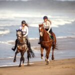 Play time  Chelsea Johnson and her stallion Cayuse Xxtra Grand (left) with Antonia Bearda and OTT Thoroughbred Up To No Good on Gerroa's Seven Mile Beach (Image by Kia Loveday, Spirit Fire Photography).