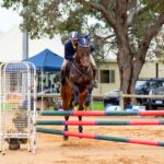 Michael Foulds and Banjo competing at the Dardanup Showjumping Day where they placed 2nd in the 1.05m and 3rd in the 95cm event (Image by Chrissy May Photography).