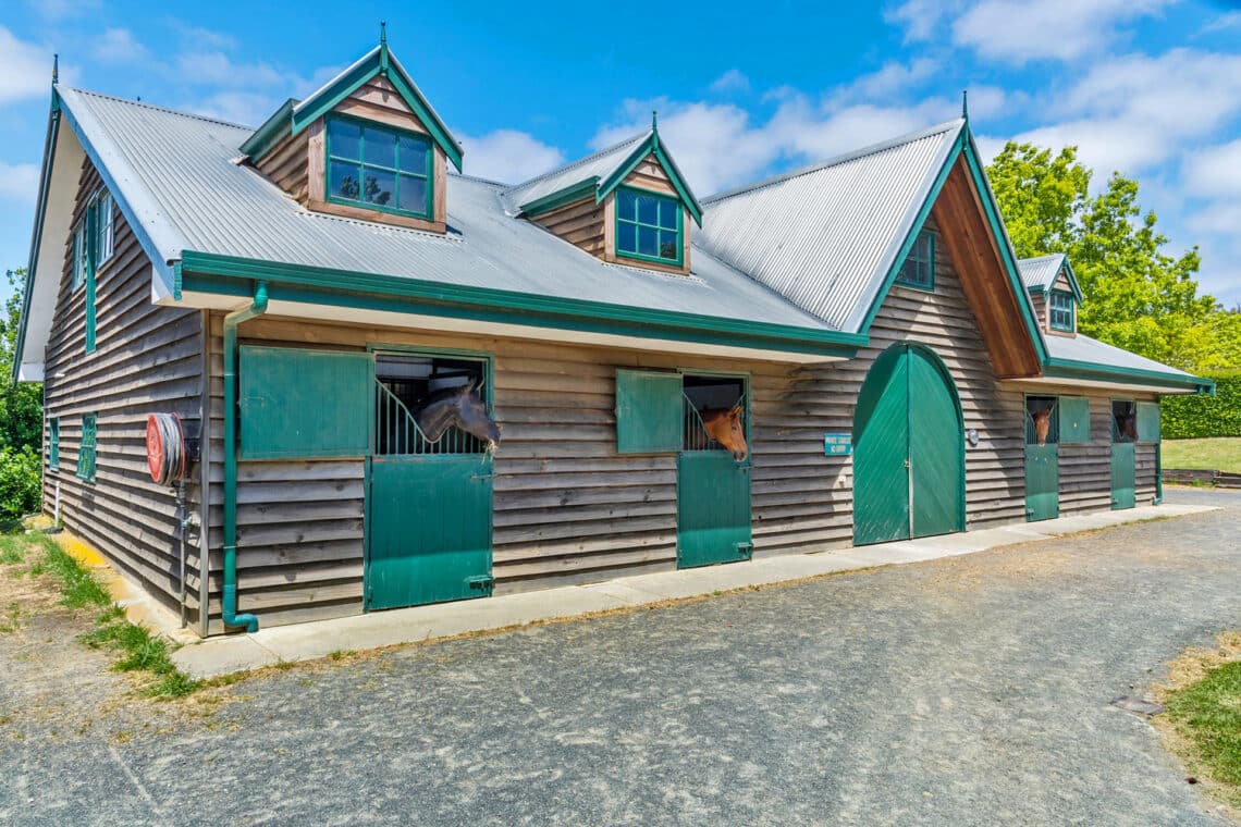 Two spacious equine complexes, one an English style barn, offer a total of 21 stables.
