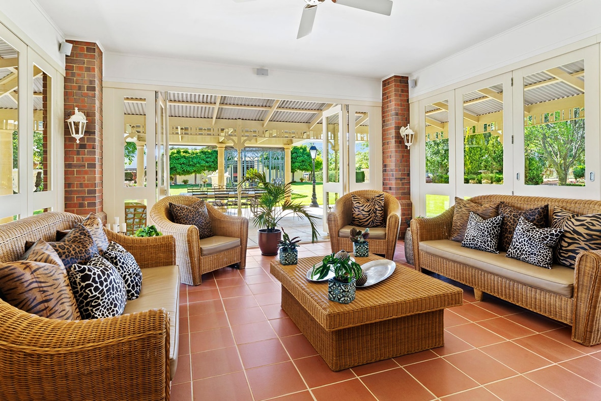 Interior spaces blend seamlessly into generous outdoor entertainment areas.